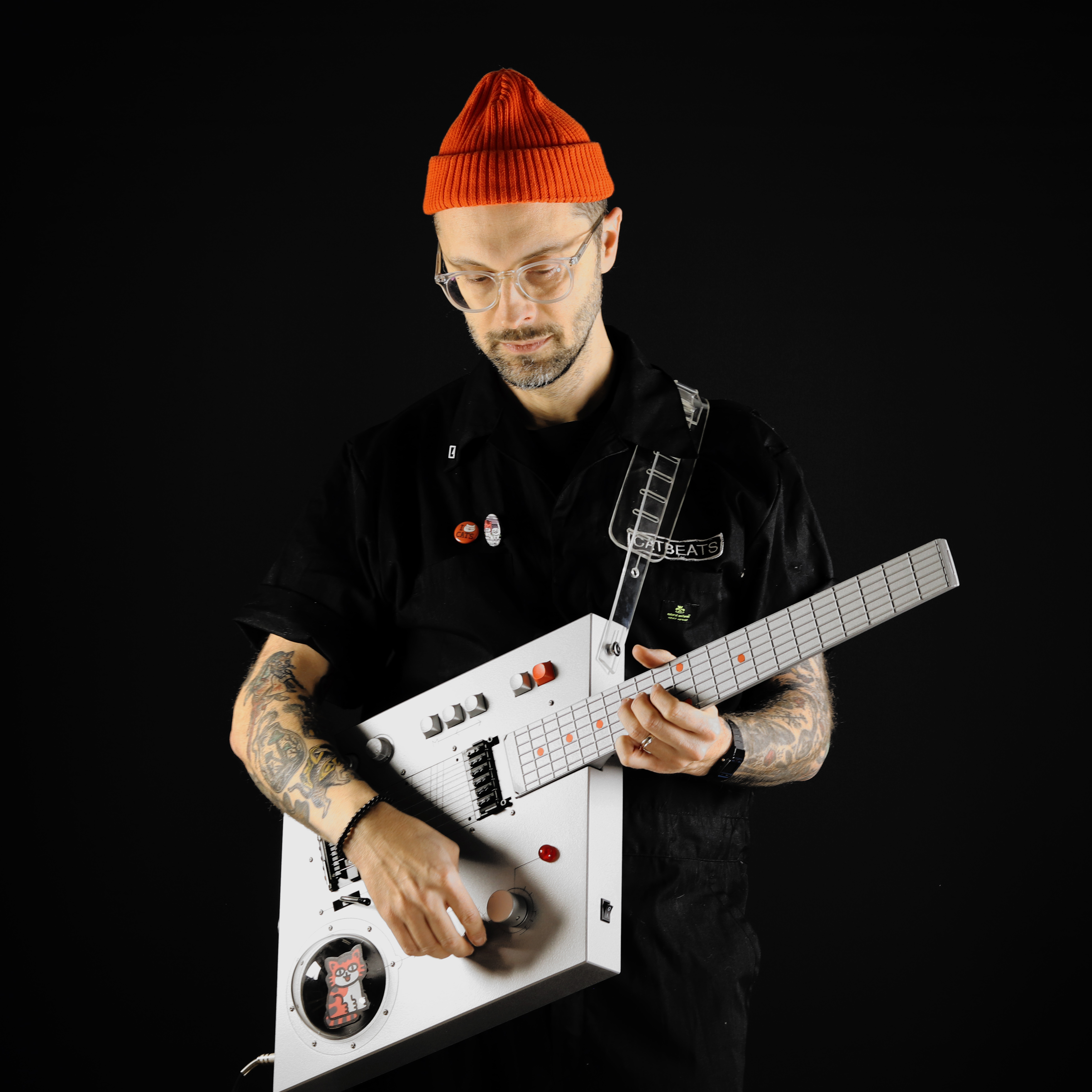 Love Hulten rhomboid midi-guitar with orange hatted player