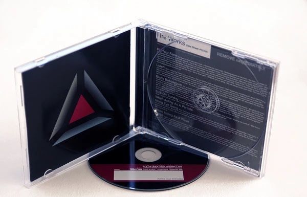The Dillinger Escape Plan, Ire Works jewel case edition with red and black triangle artwork
