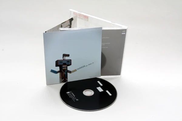 Mirror CD digipak, pale blue robot-figure illustration